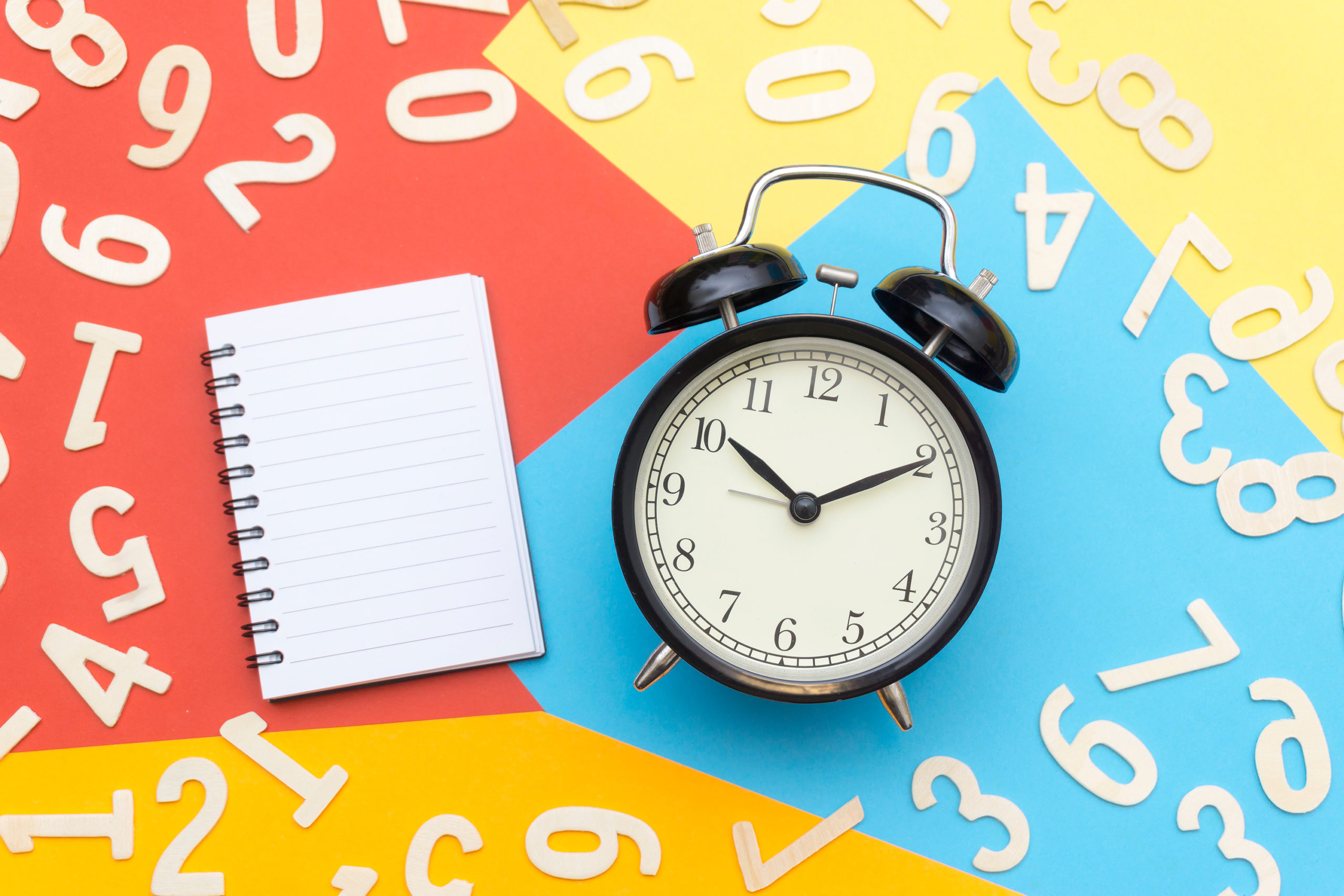 Canva - Alarm Clock Lying on Multicolored Surface Canva - Alarm Clock Lying on Multicolored Surface